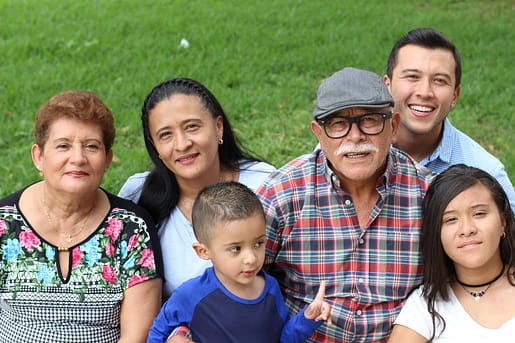 Happy immigrant family together after successful reunification.